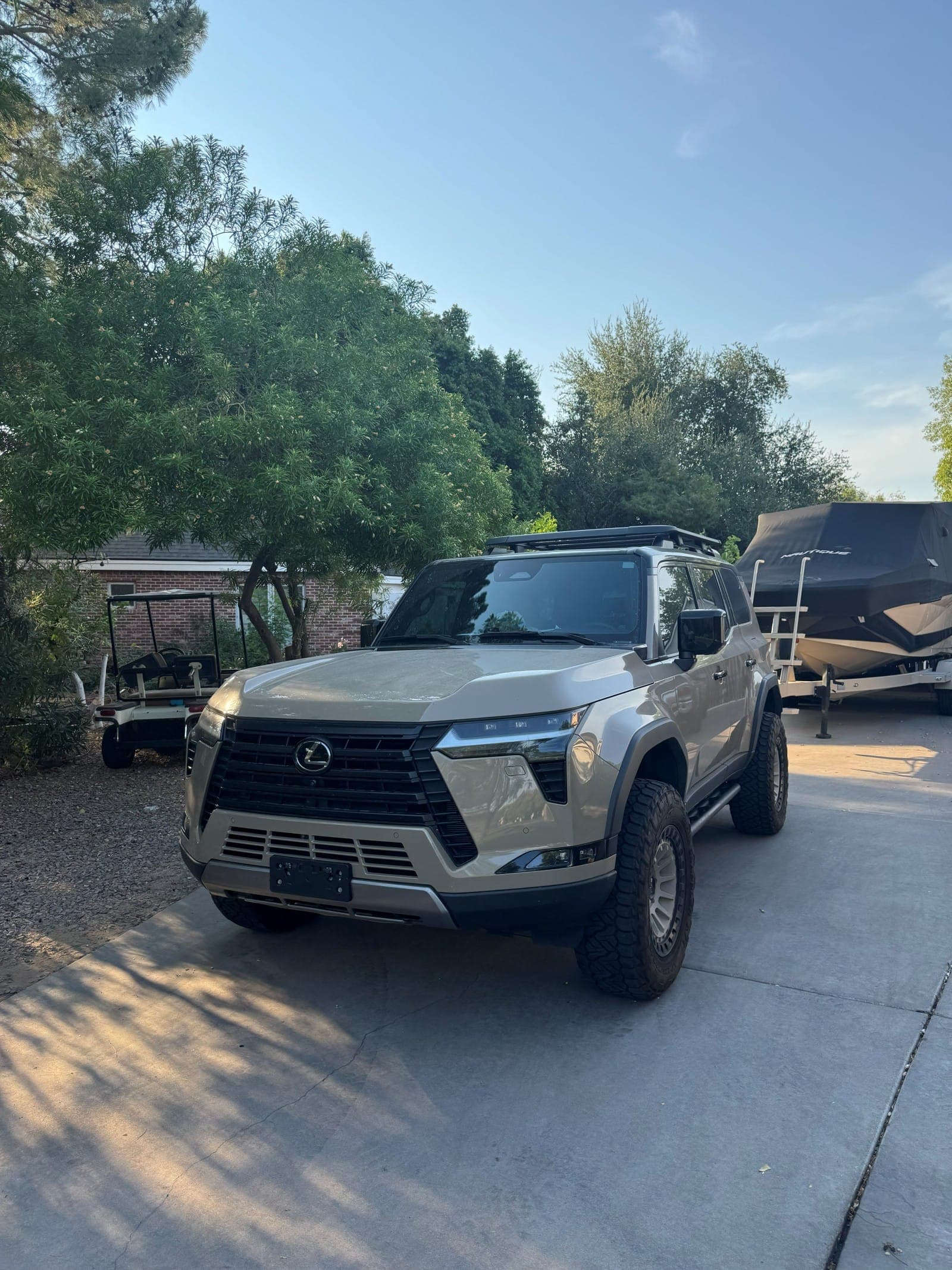Lexus GX in a Mesa driveway before its detail
