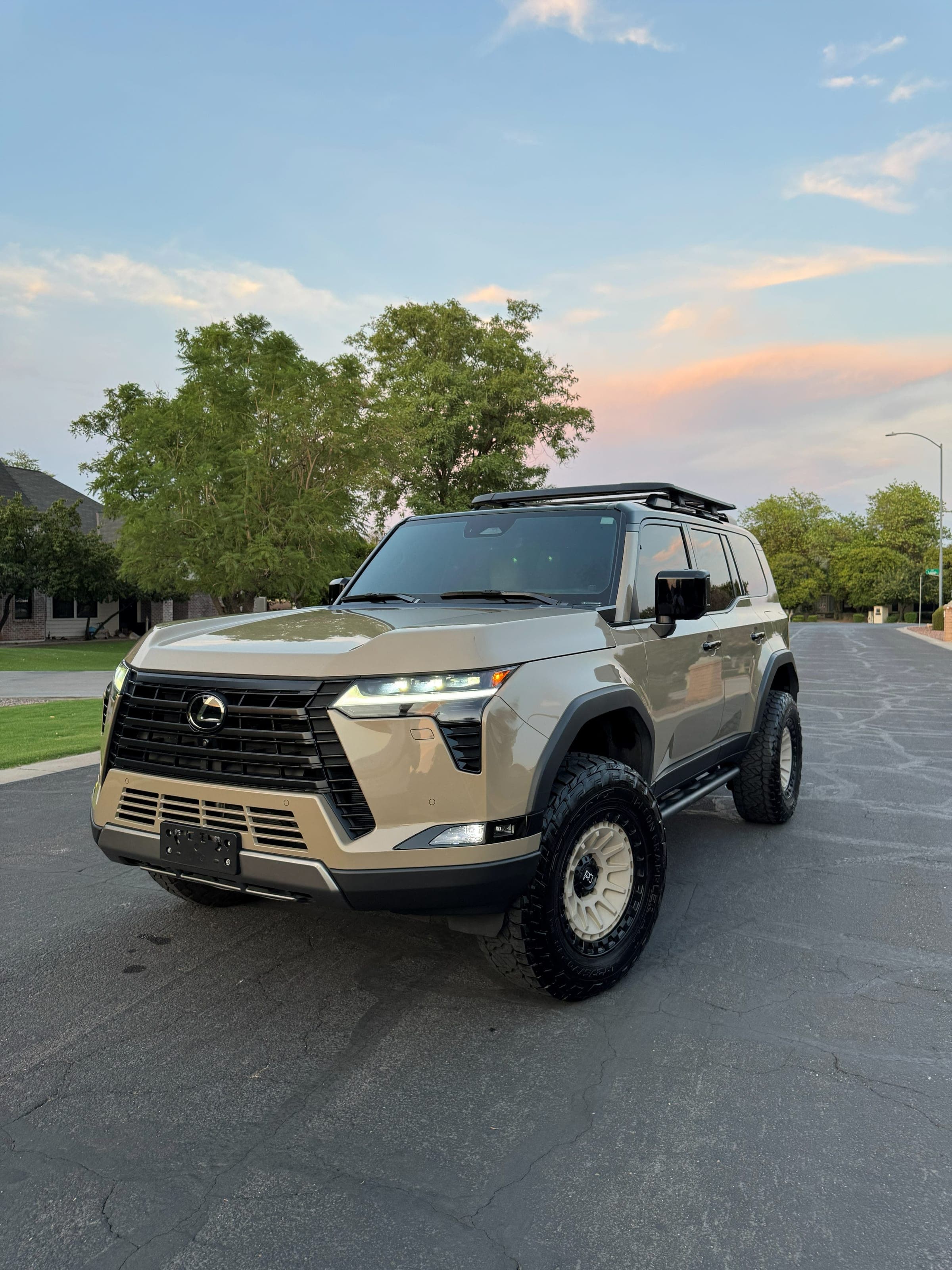 Freshly detailed tan Lexus GX at sunset on a Mesa street